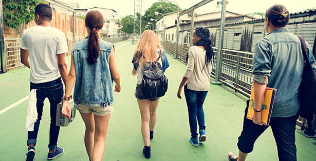 image of teens walking down the street