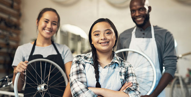 image of teen working in a bike shop